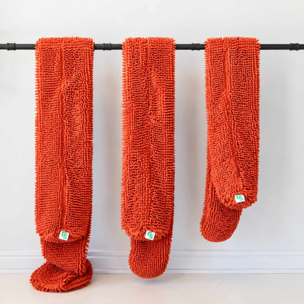 M, L & XL CrateSnake Original Cover in Burnt Orange hanging up